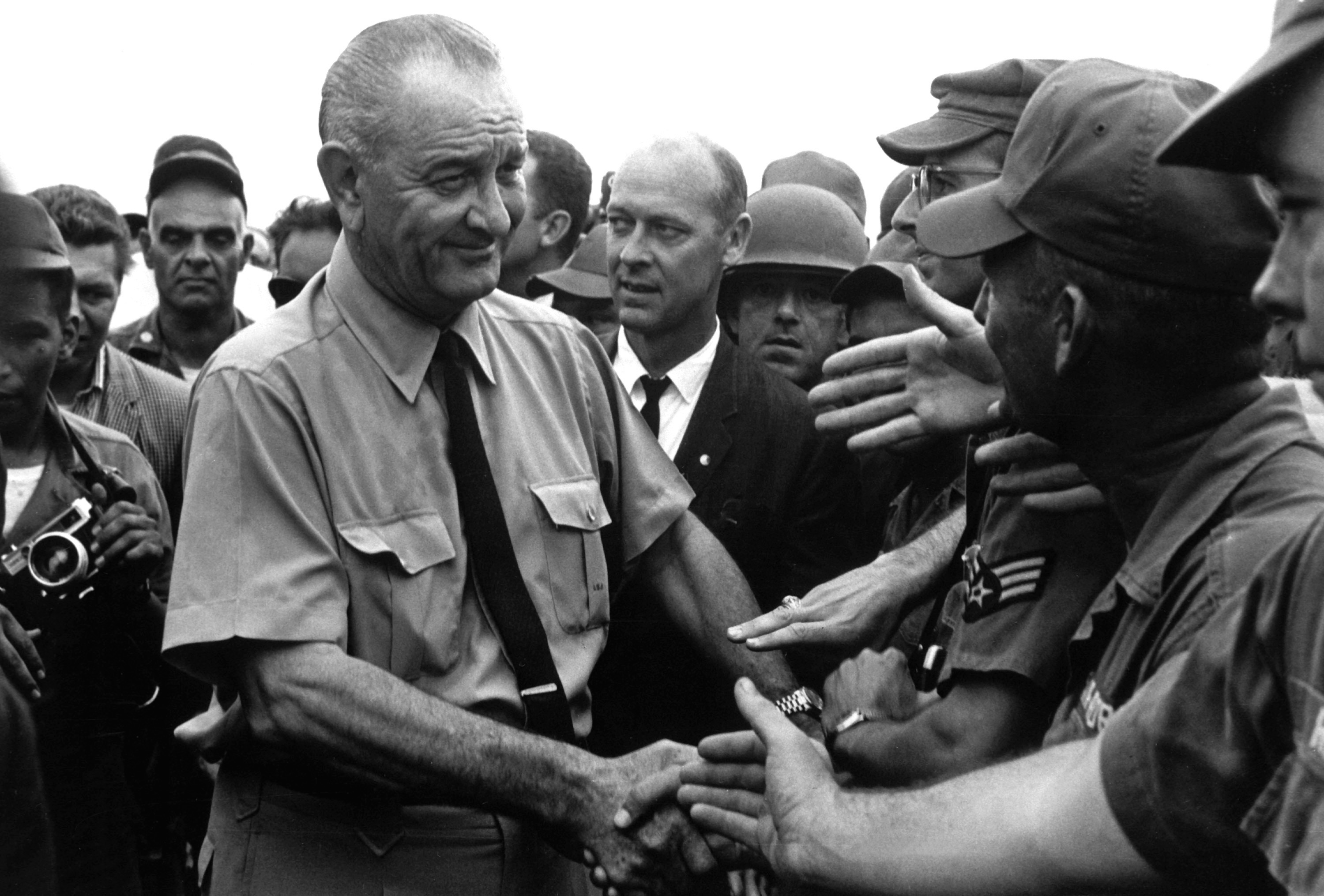 President Lyndon B. Johnson greets American troops in Vietnam.