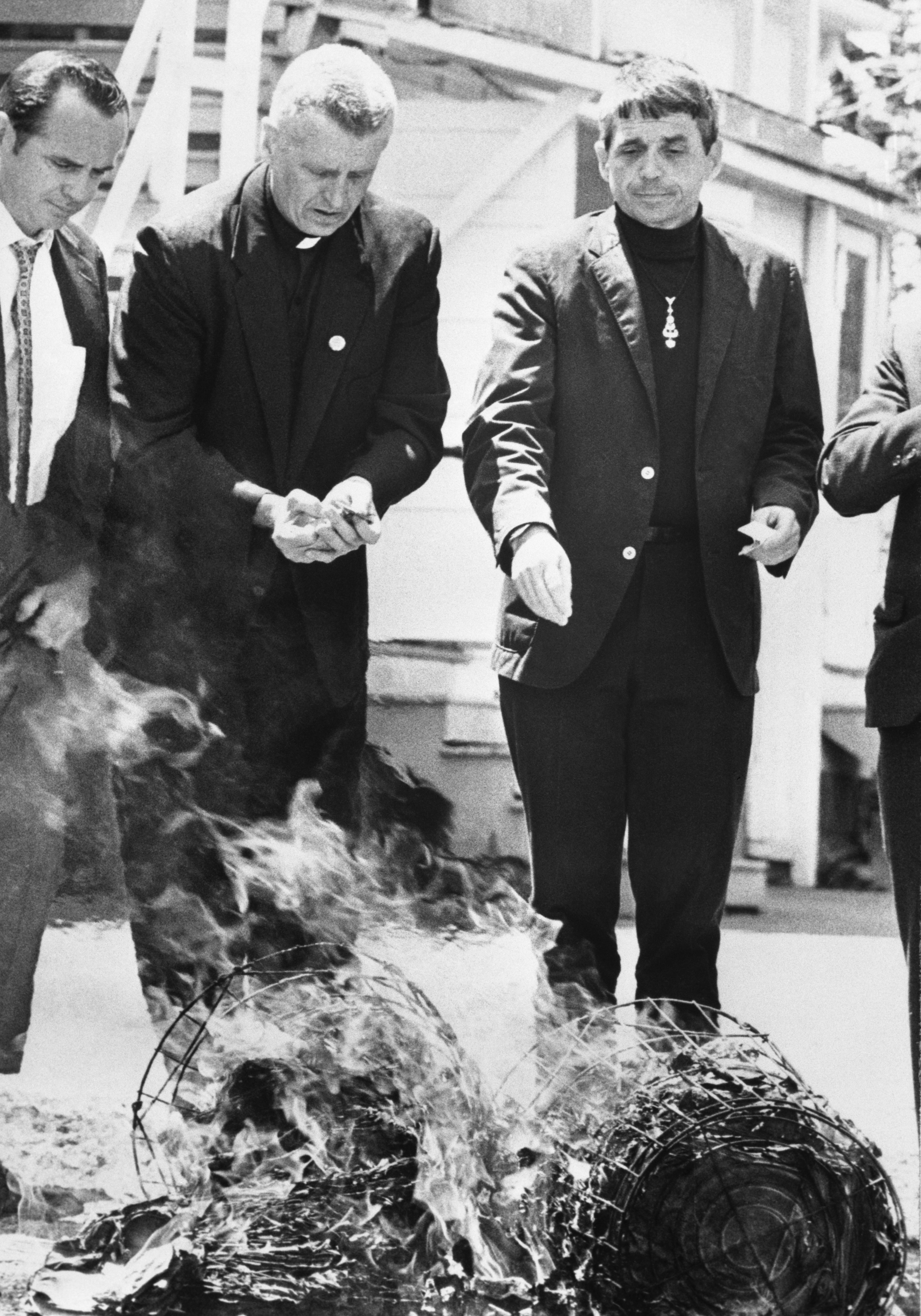 Berrigan brothers burn draft records