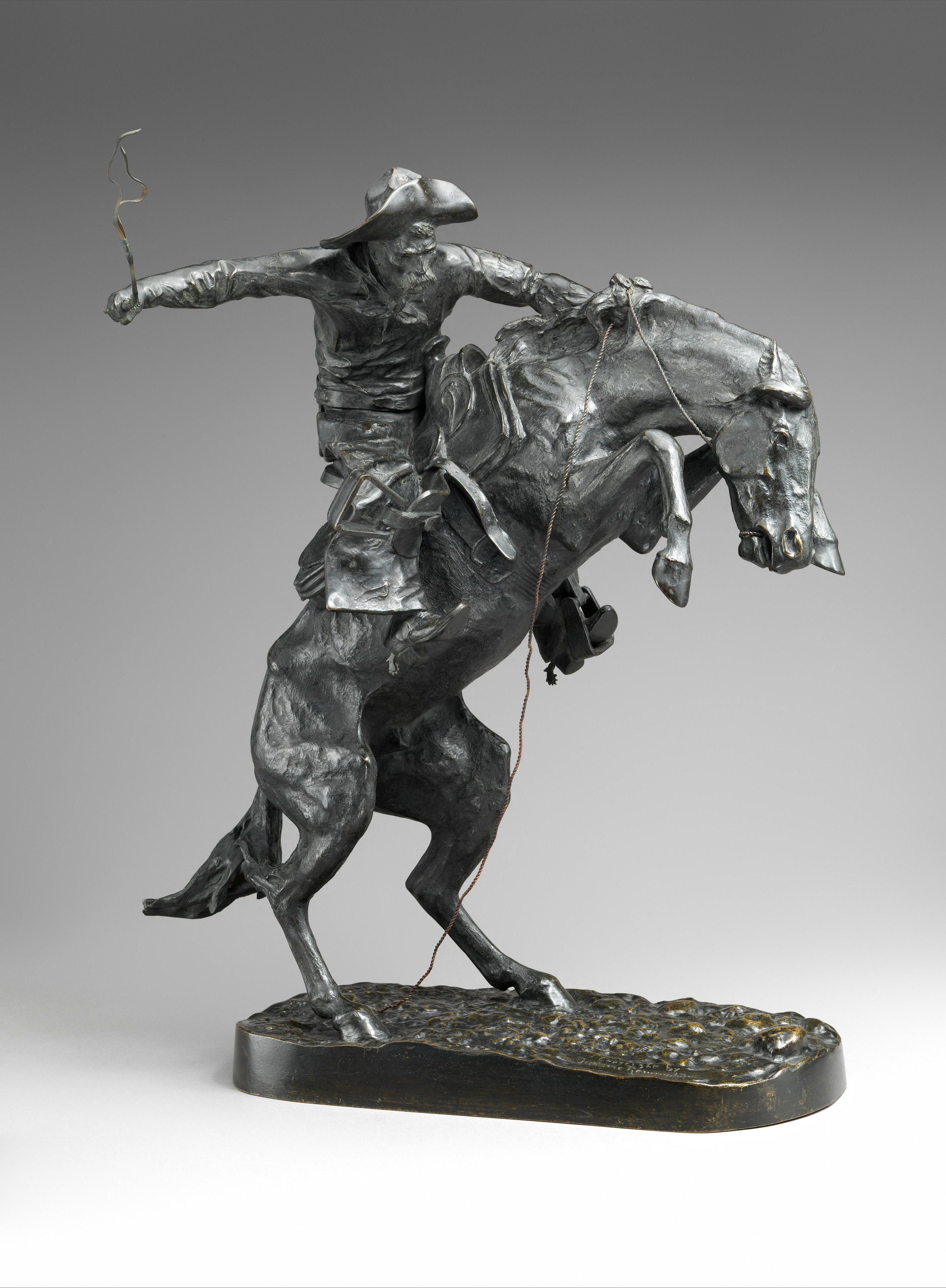 The Bronco Buster by Frederic Remington