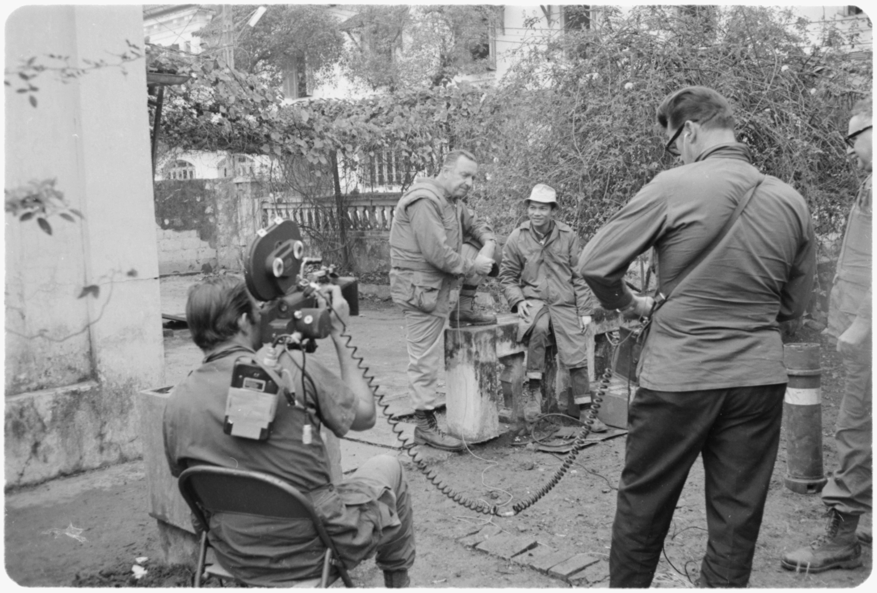 Walter Cronkite (center) reporting from Vietnam