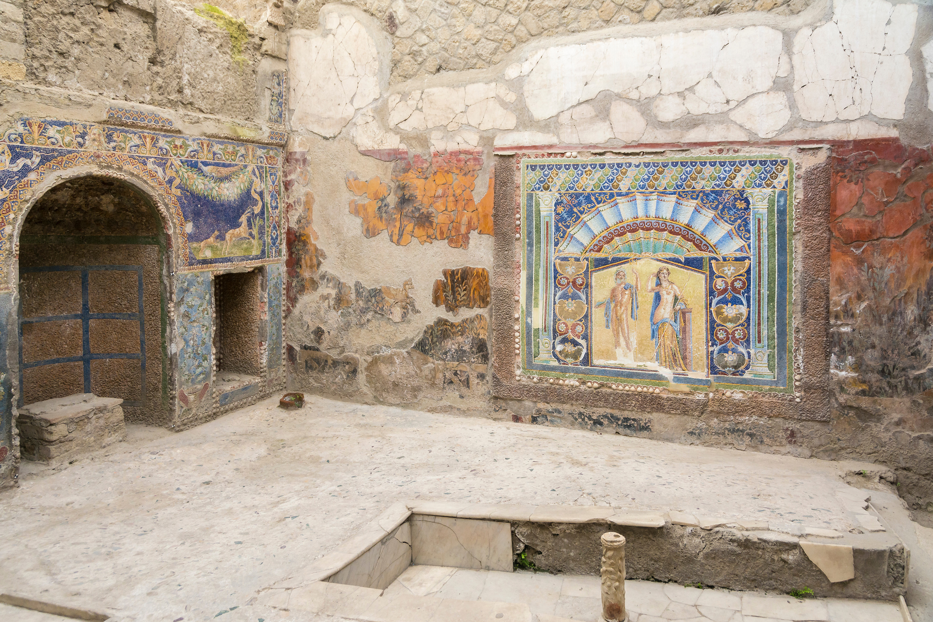 Wall mosaic and ruins at the ancient city of Herculaneum