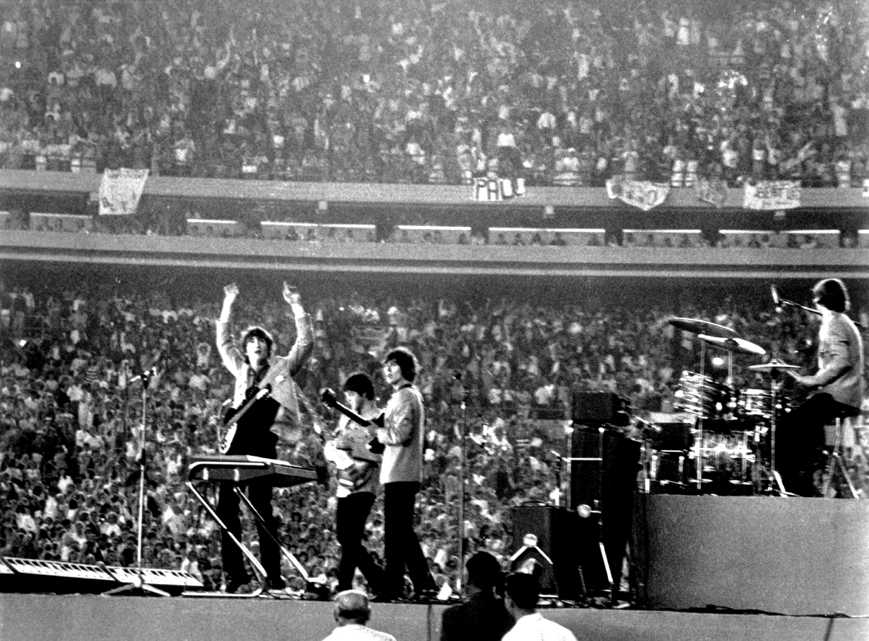 The Beatles performing at Shea Stadium