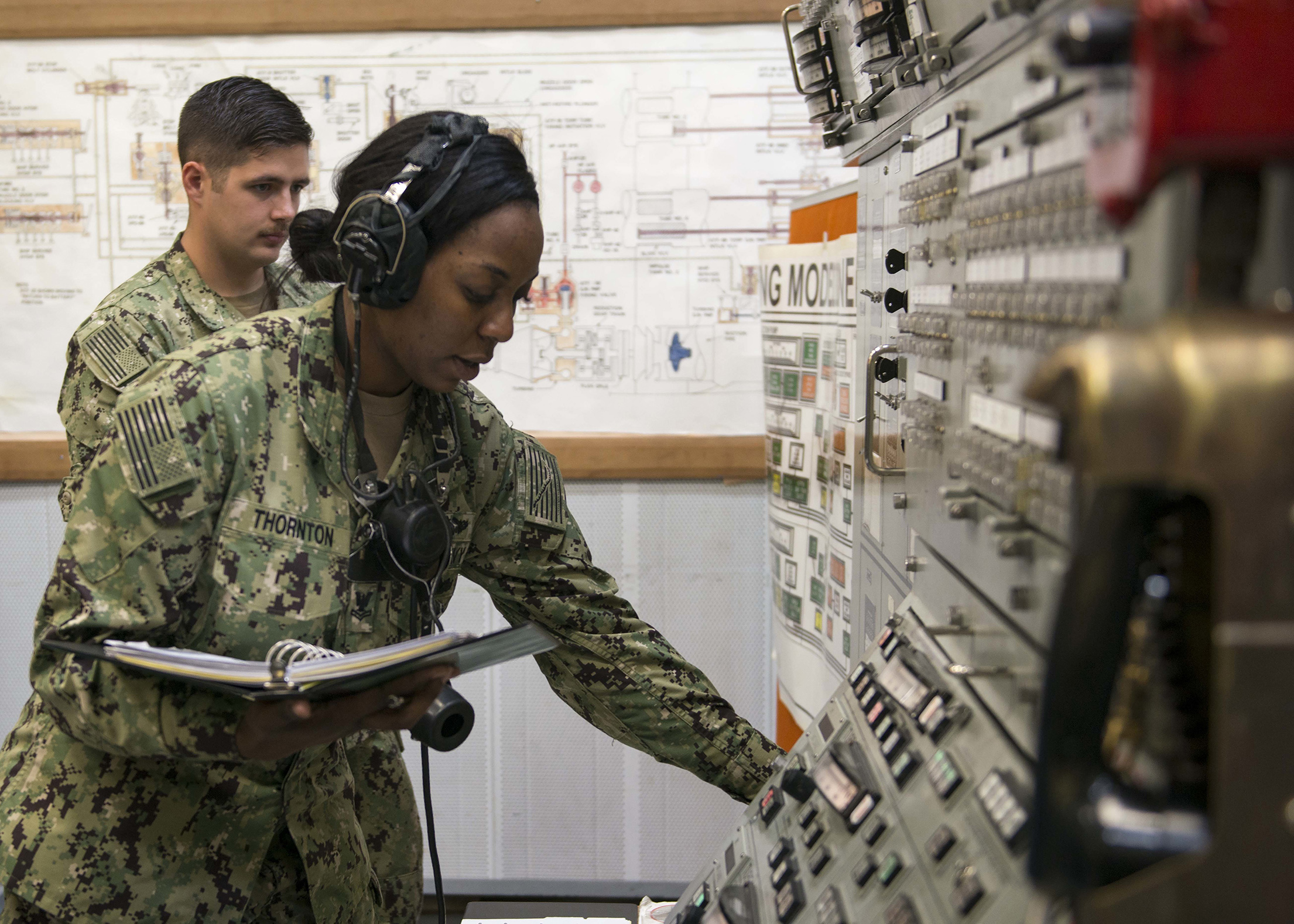 A U.S. Navy sailor trains to fire torpedoes