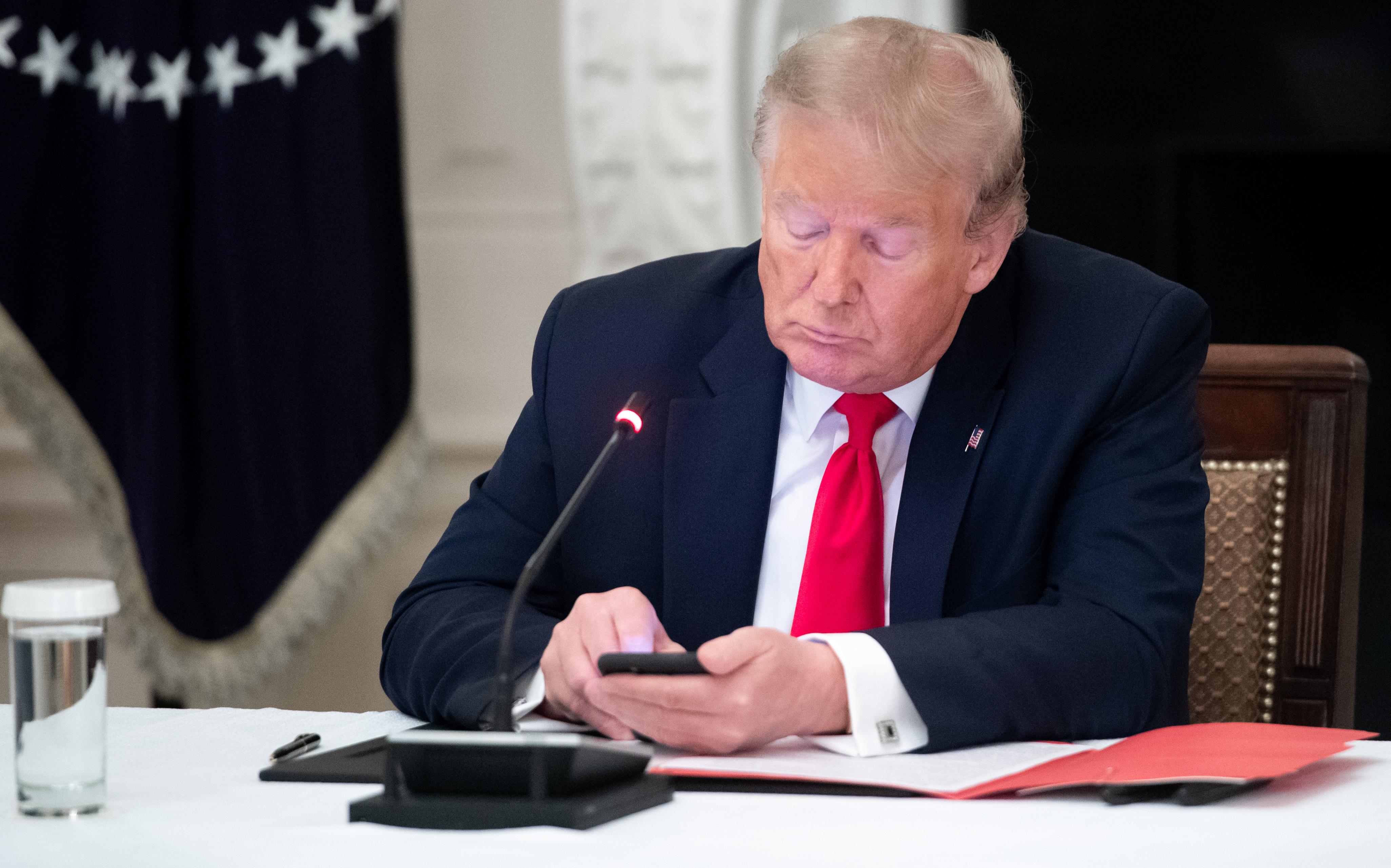 President Trump using his smartphone