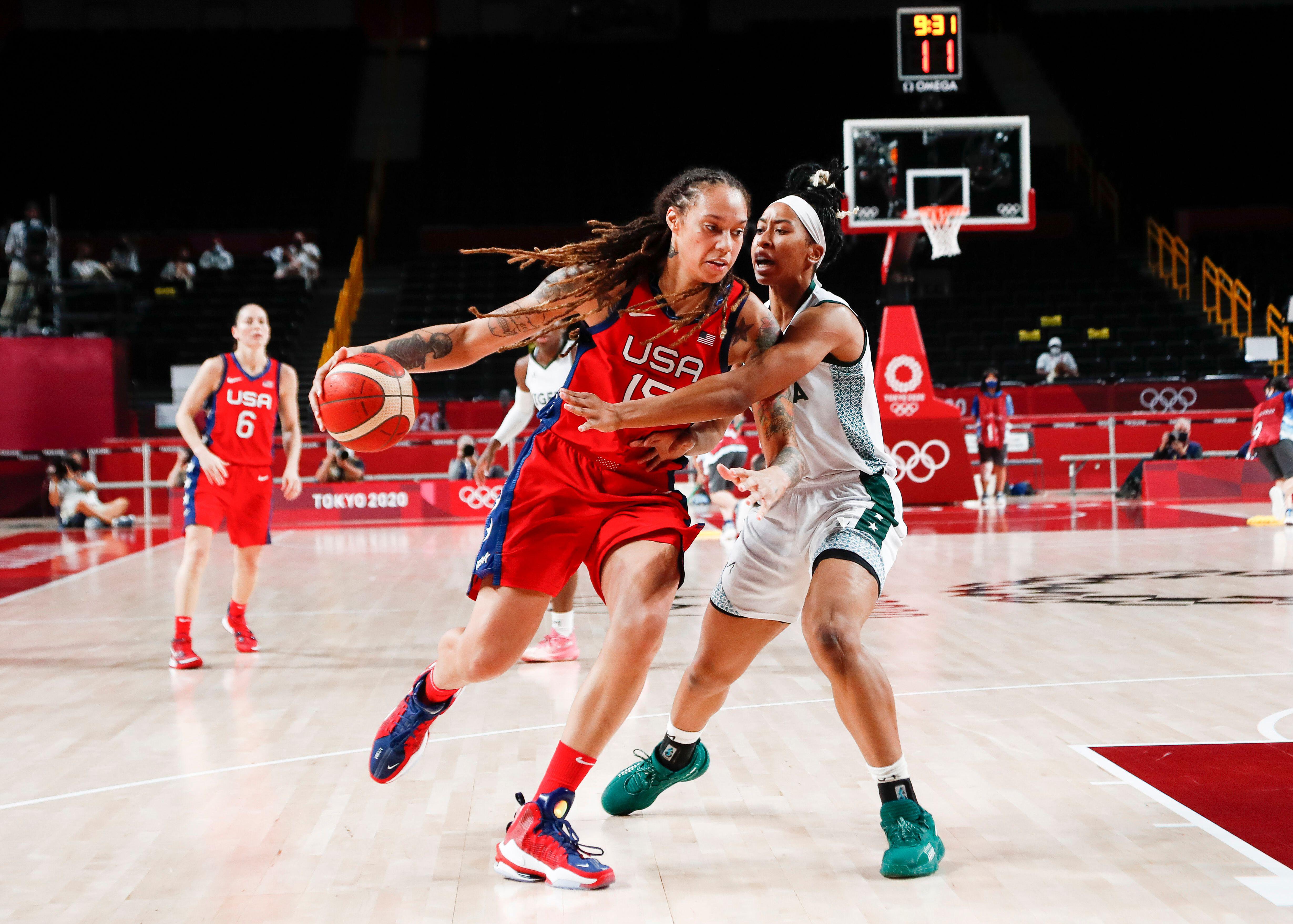 American basketball player Brittney Griner (with ball)