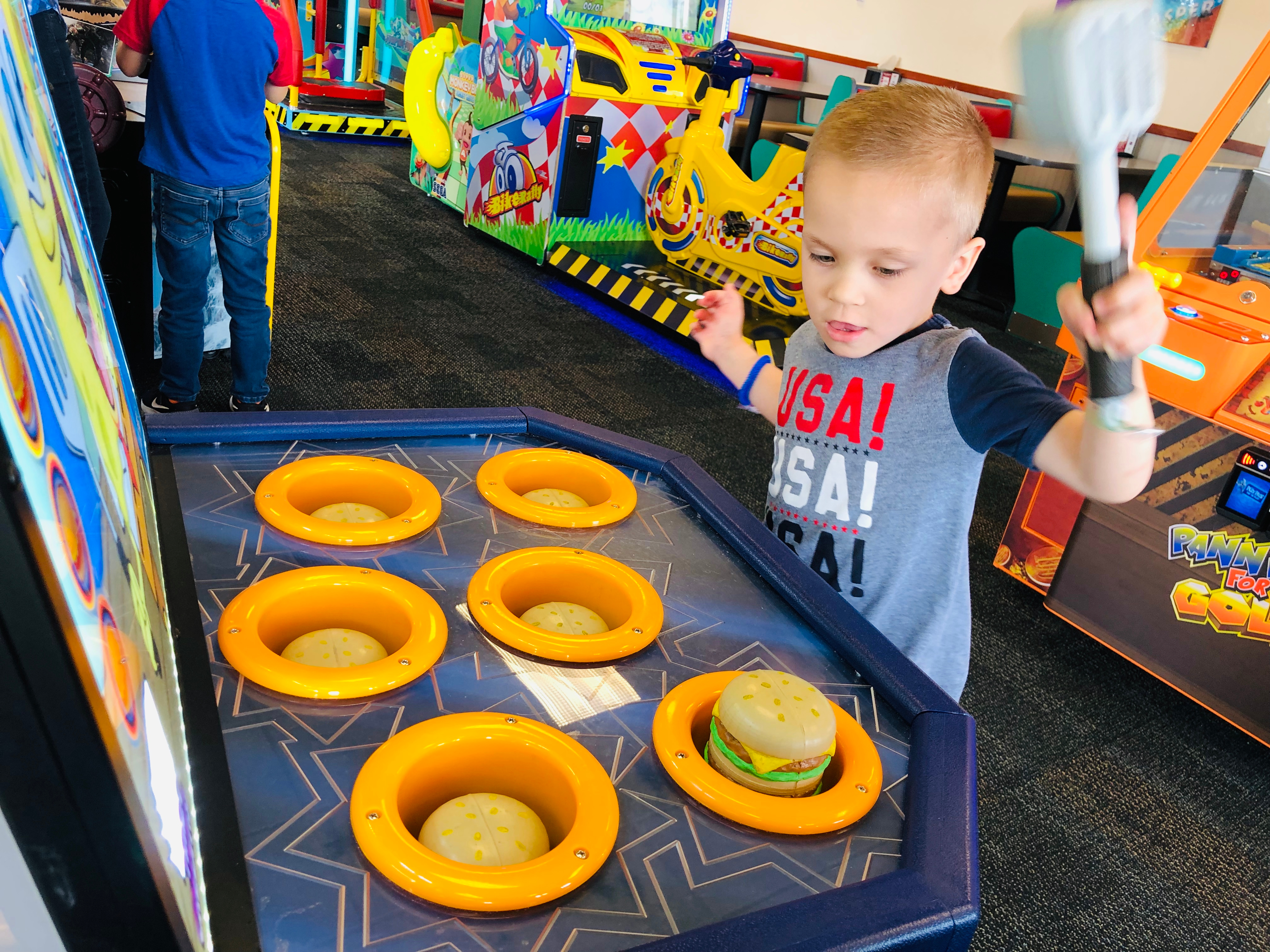 Child playing a game at an entertainment restaurant