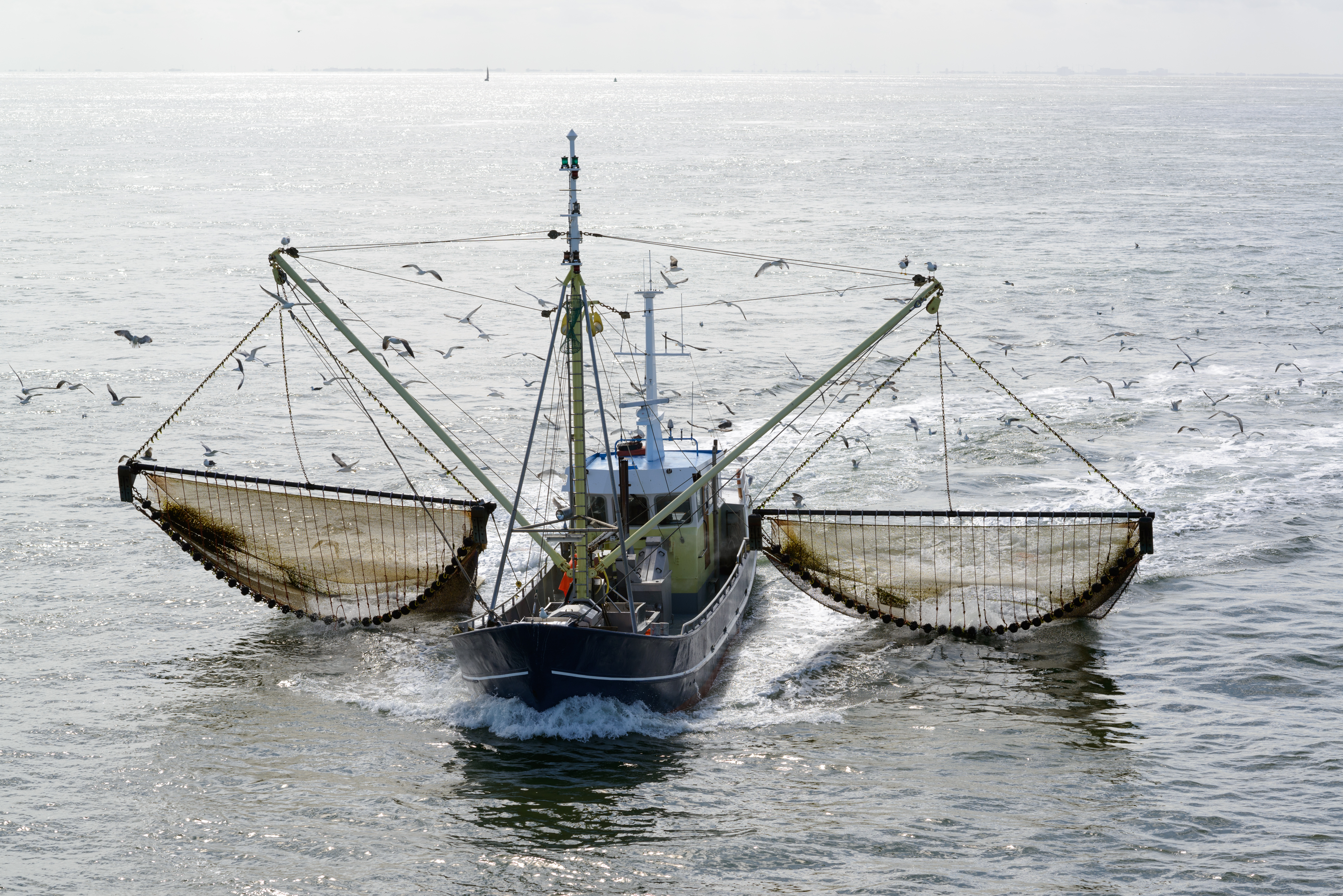 A fishing boat dragging large nets