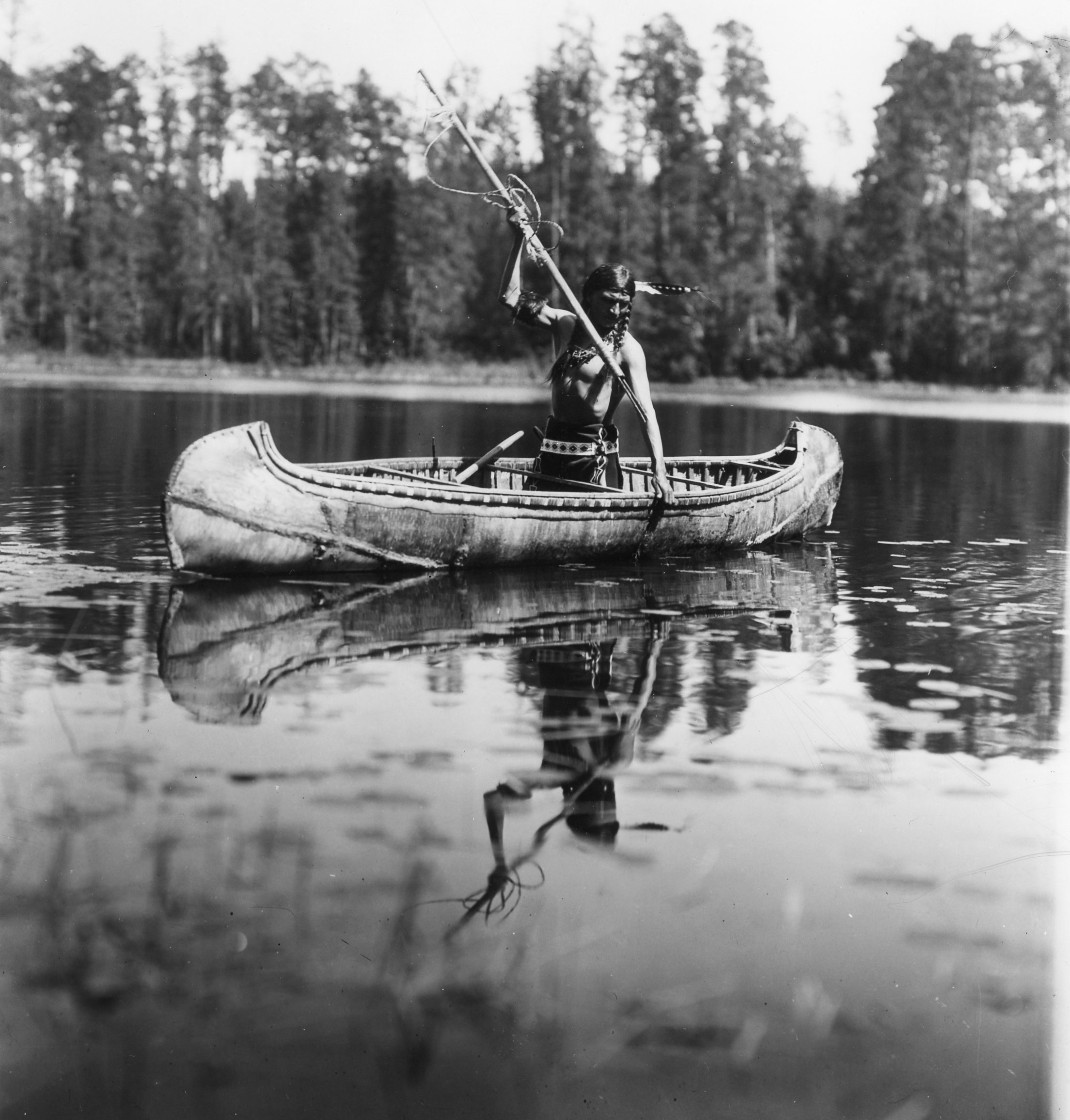 Ojibwe man spearfishing