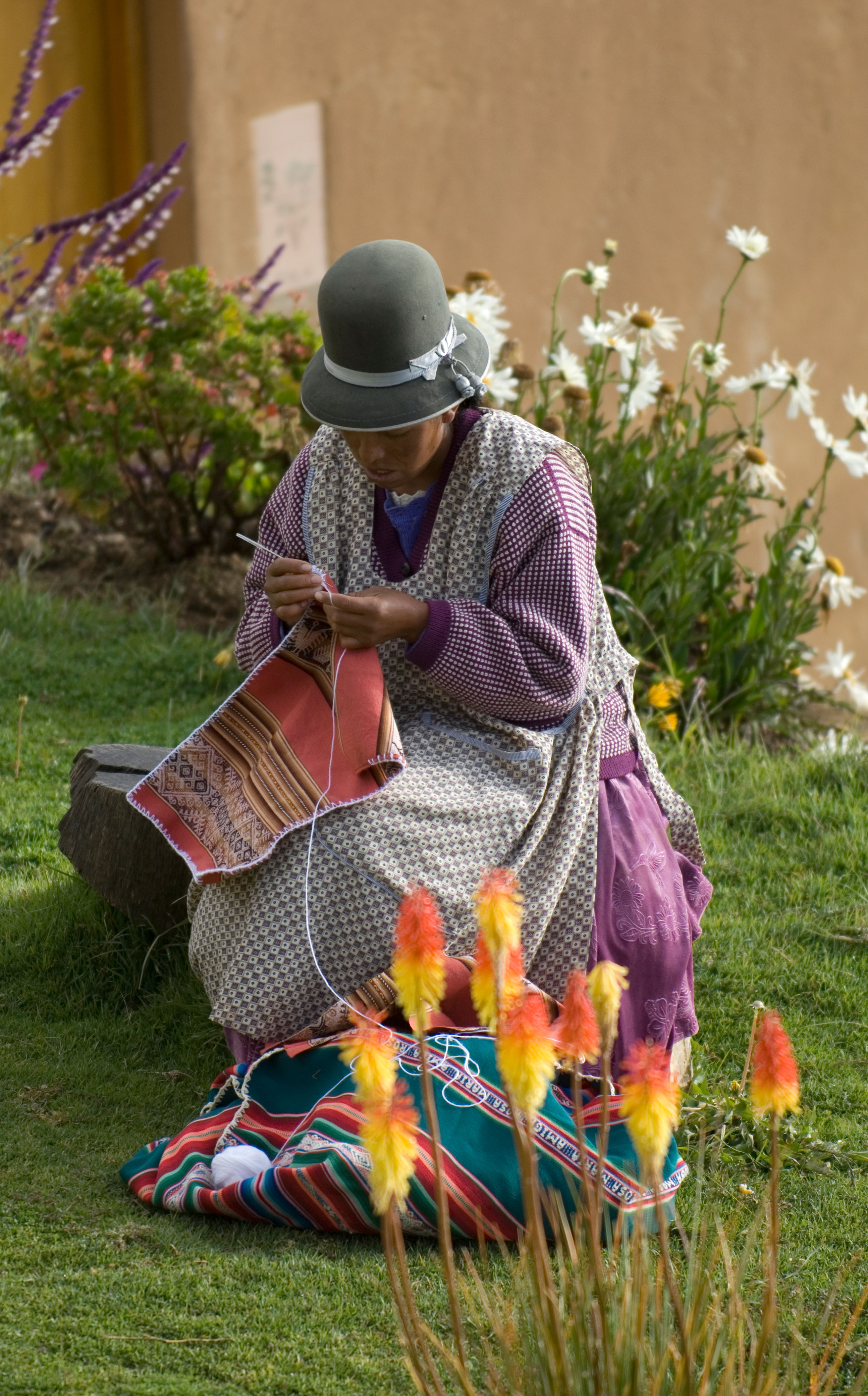 Bolivian woman crocheting woolen fabric