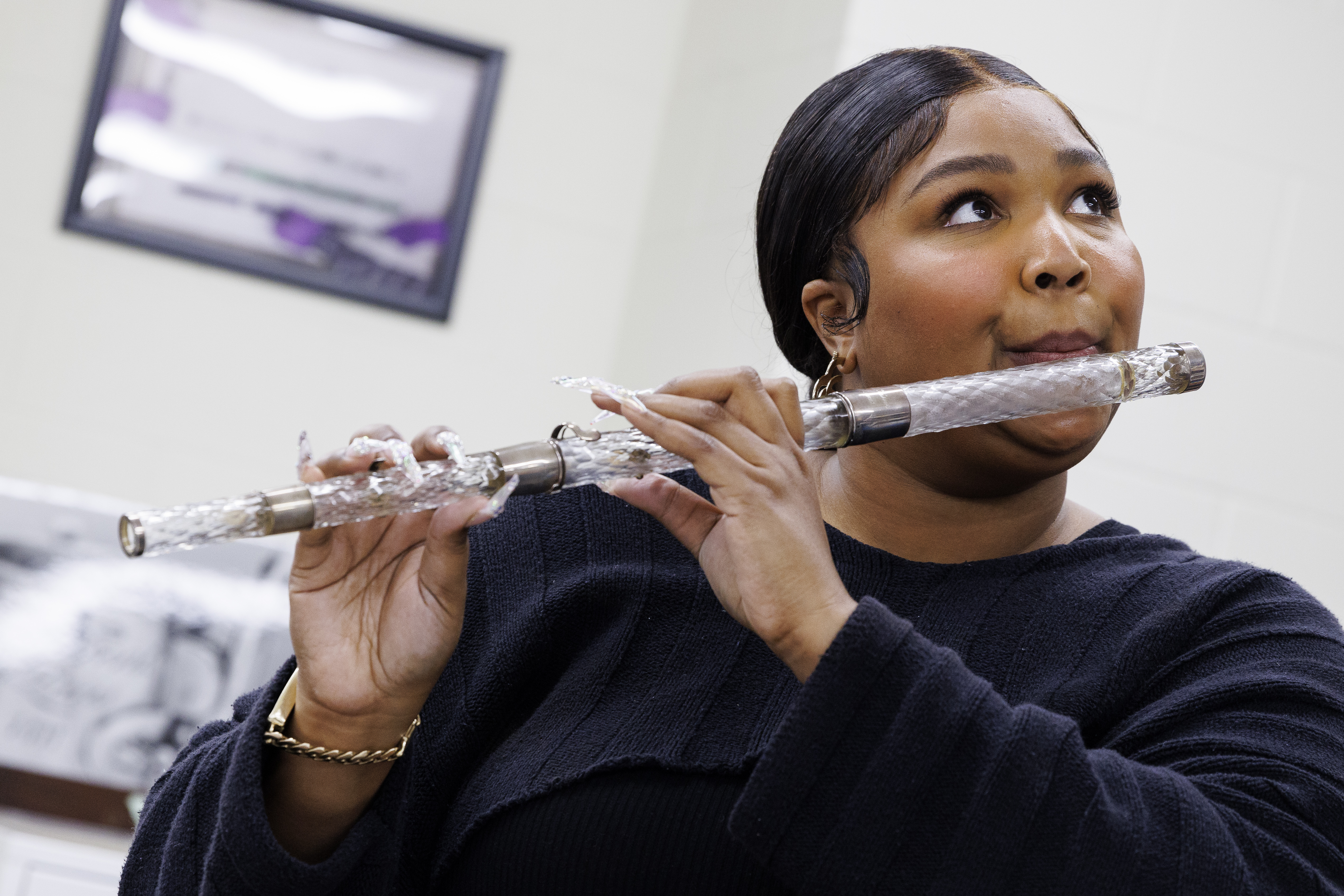 American musician Lizzo plays crystal flute