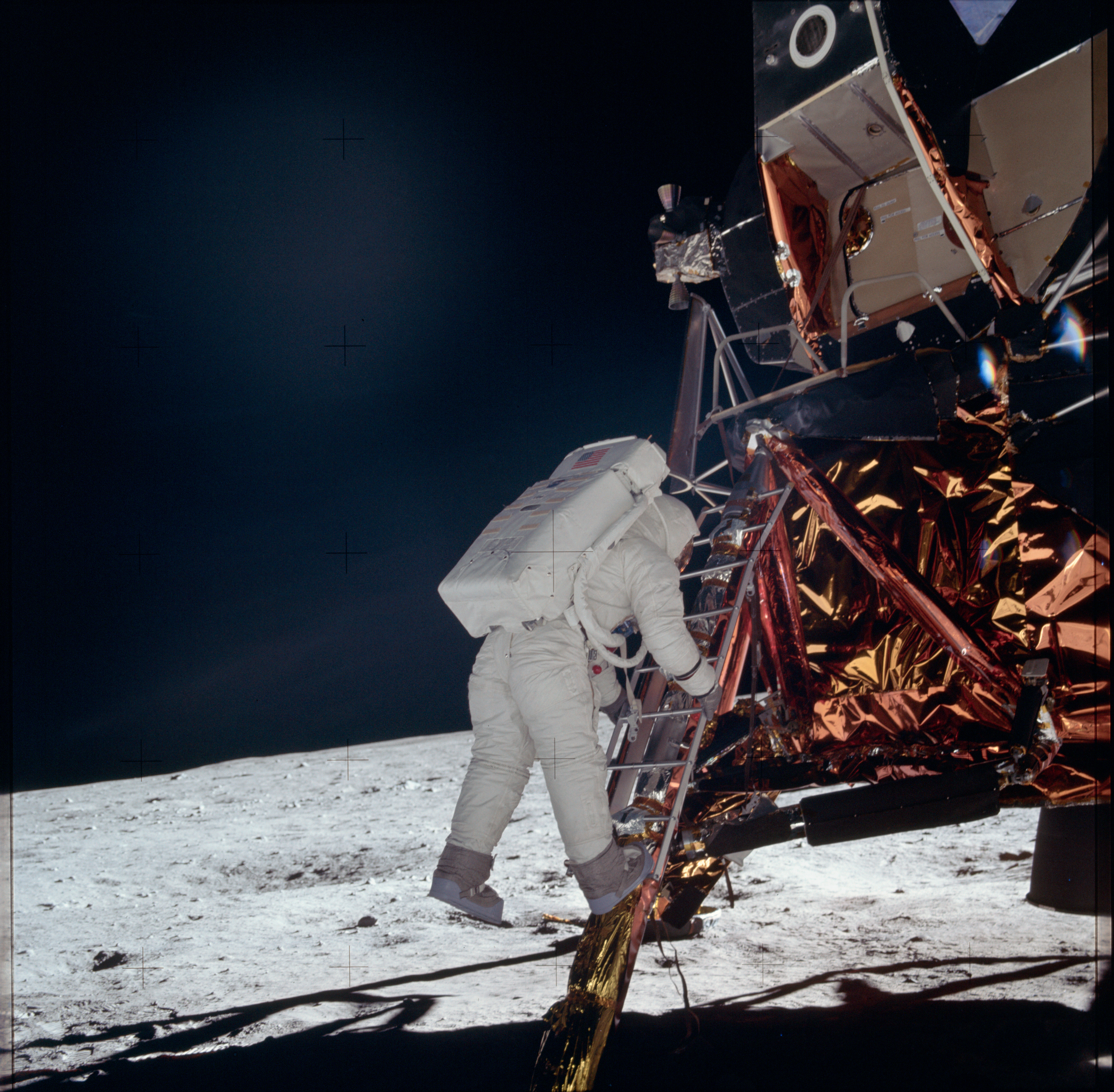 American astronaut Buzz Aldrin stepping onto the moon in 1969