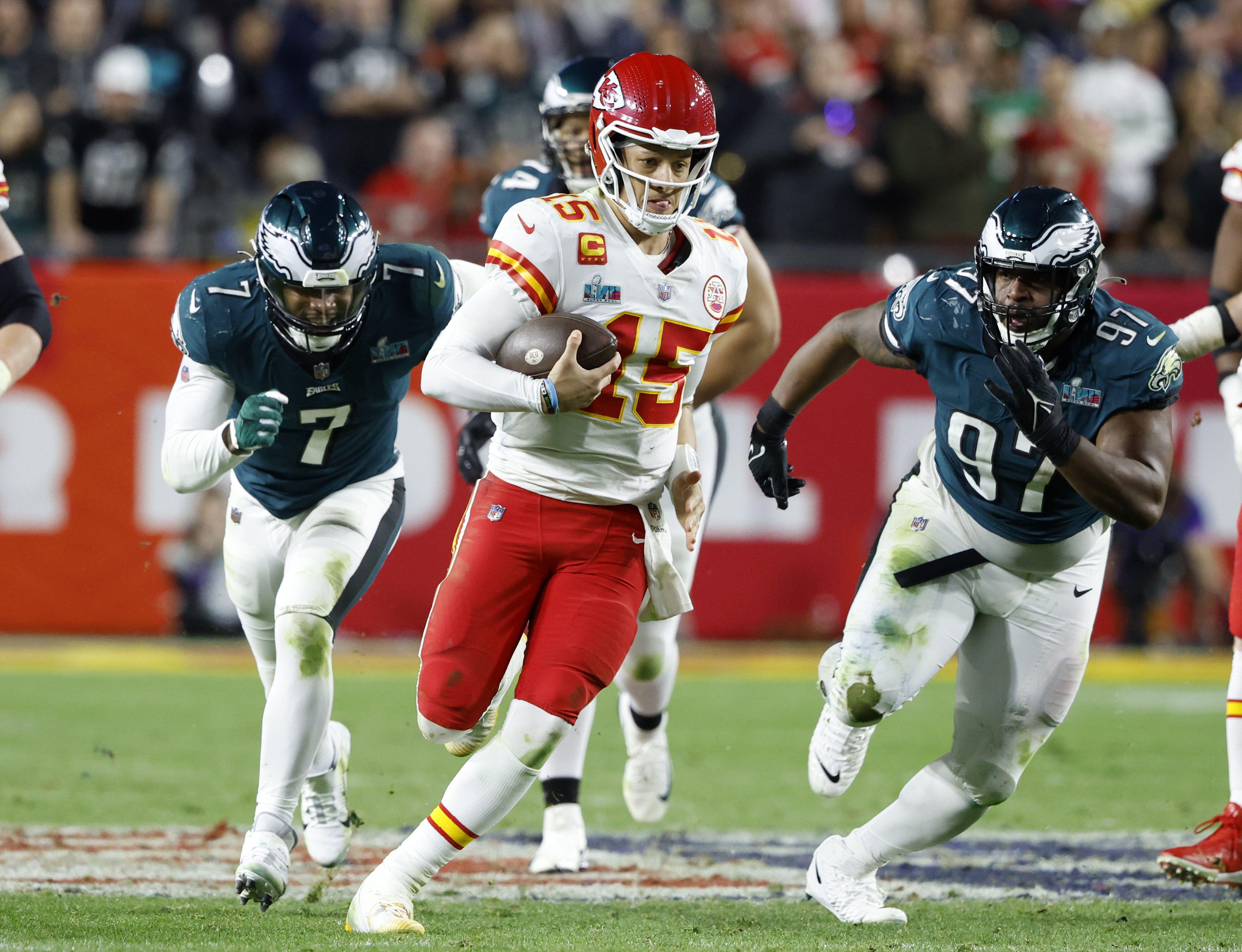 Quarterback Patrick Mahomes carries the football in the 2023 Super Bowl