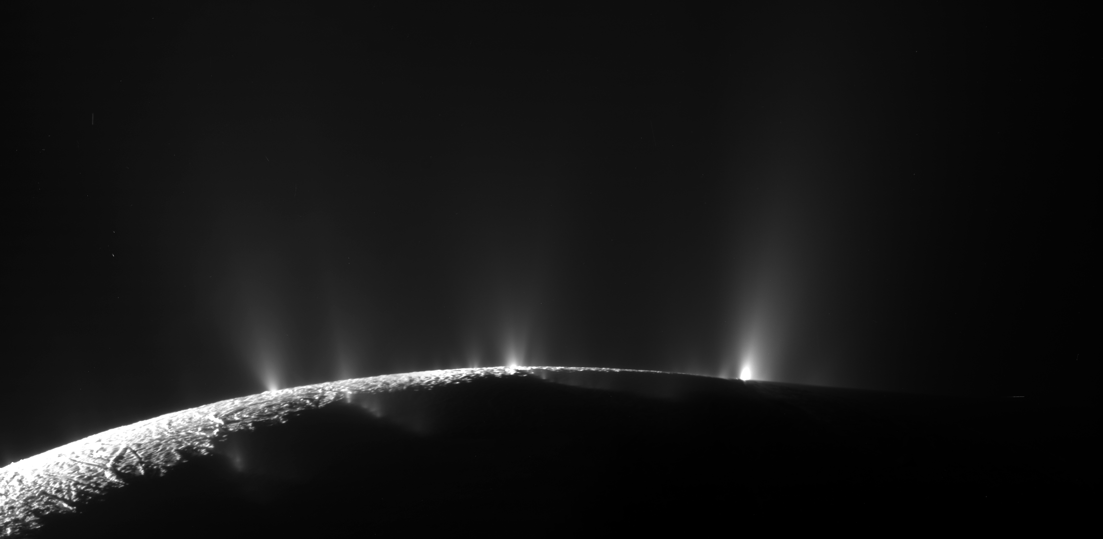 Geysers bursting through the icy crust of Enceladus