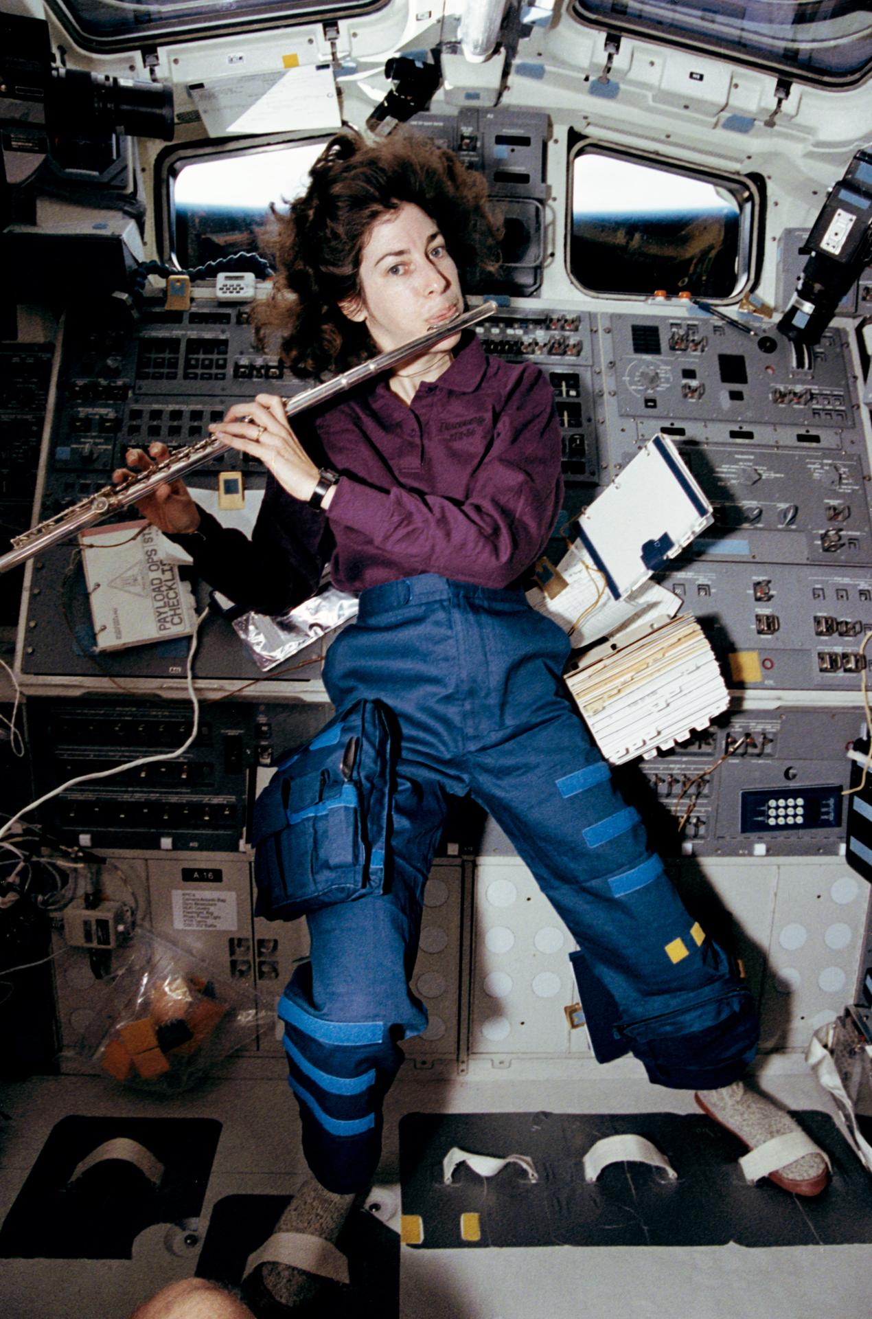 Astronaut Ellen Ochoa plays the flute in space