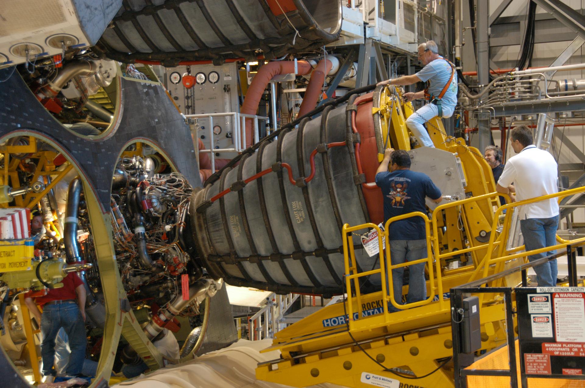 Installing an engine on the space shuttle orbiter