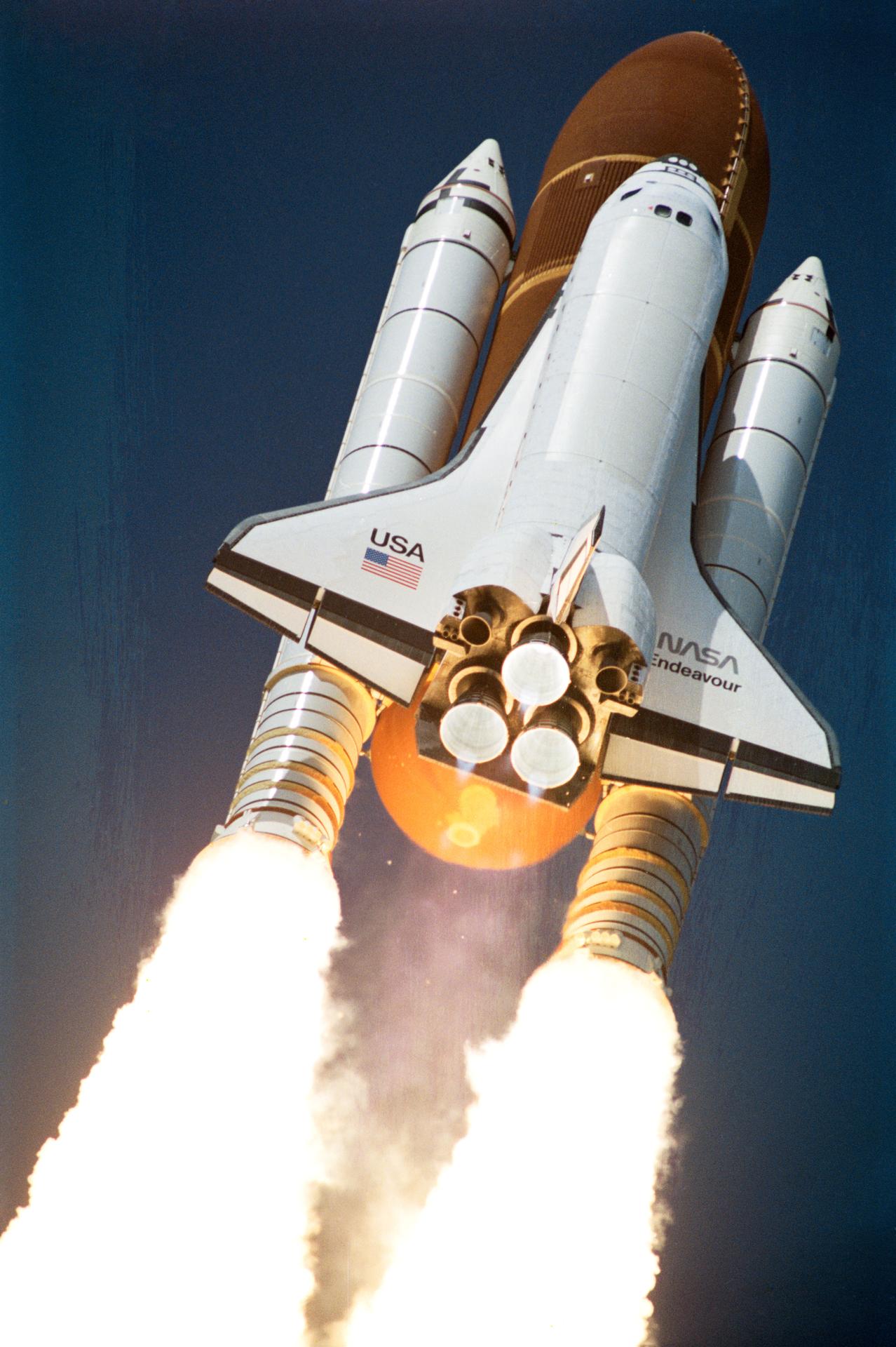 The space shuttle's solid boosters and main engines during launch