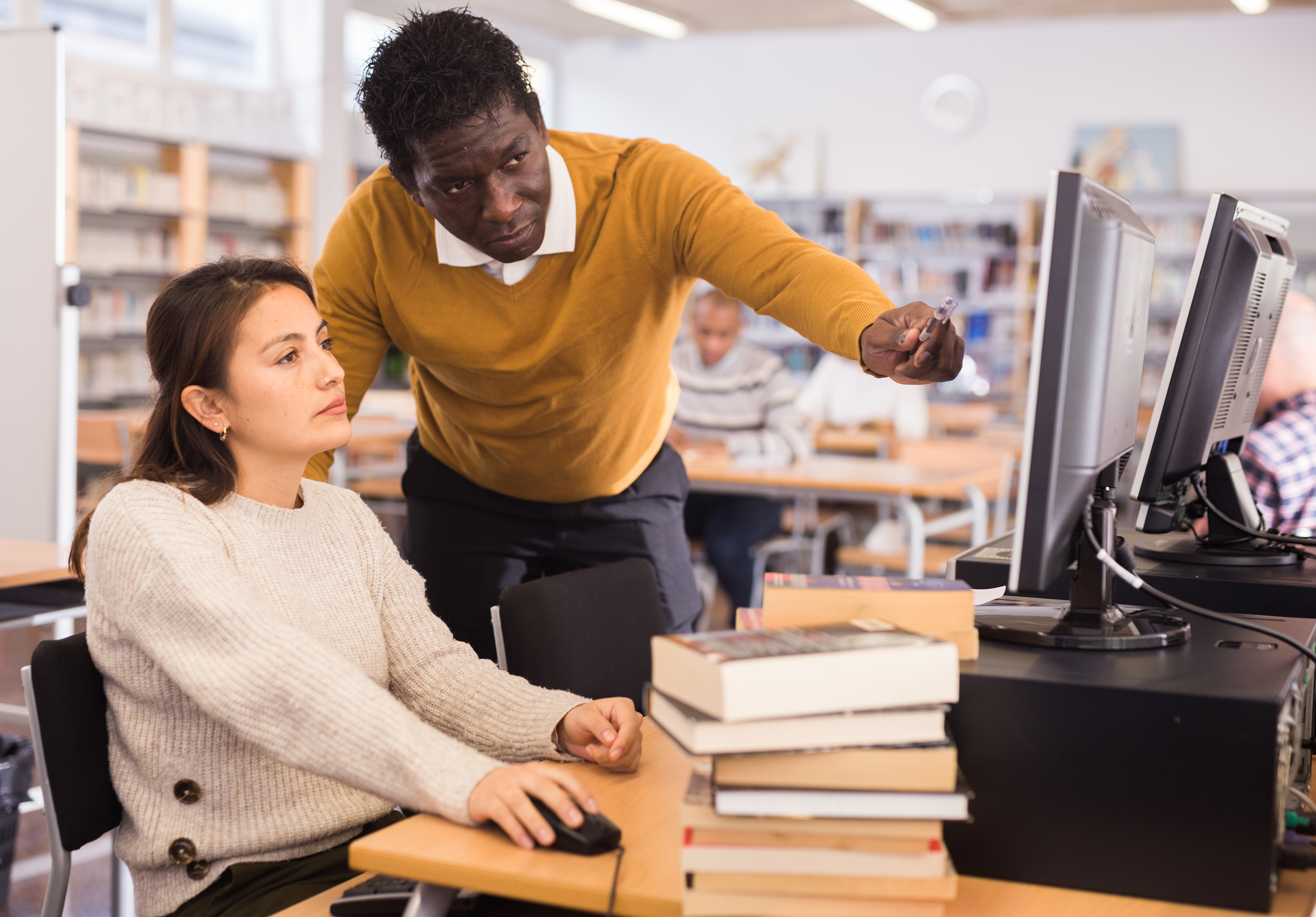 Librarian helping a patron