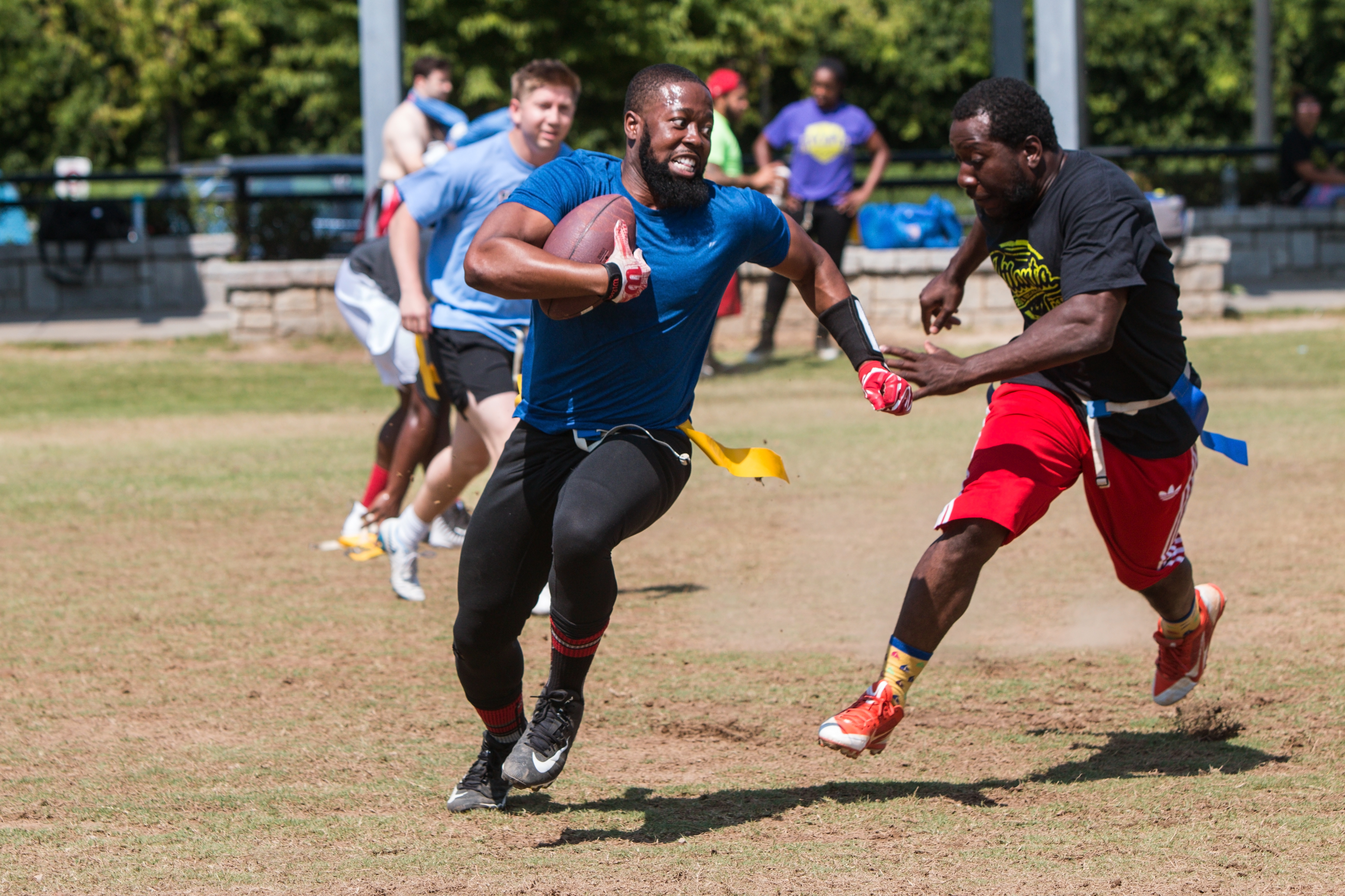 Two men playing flag football